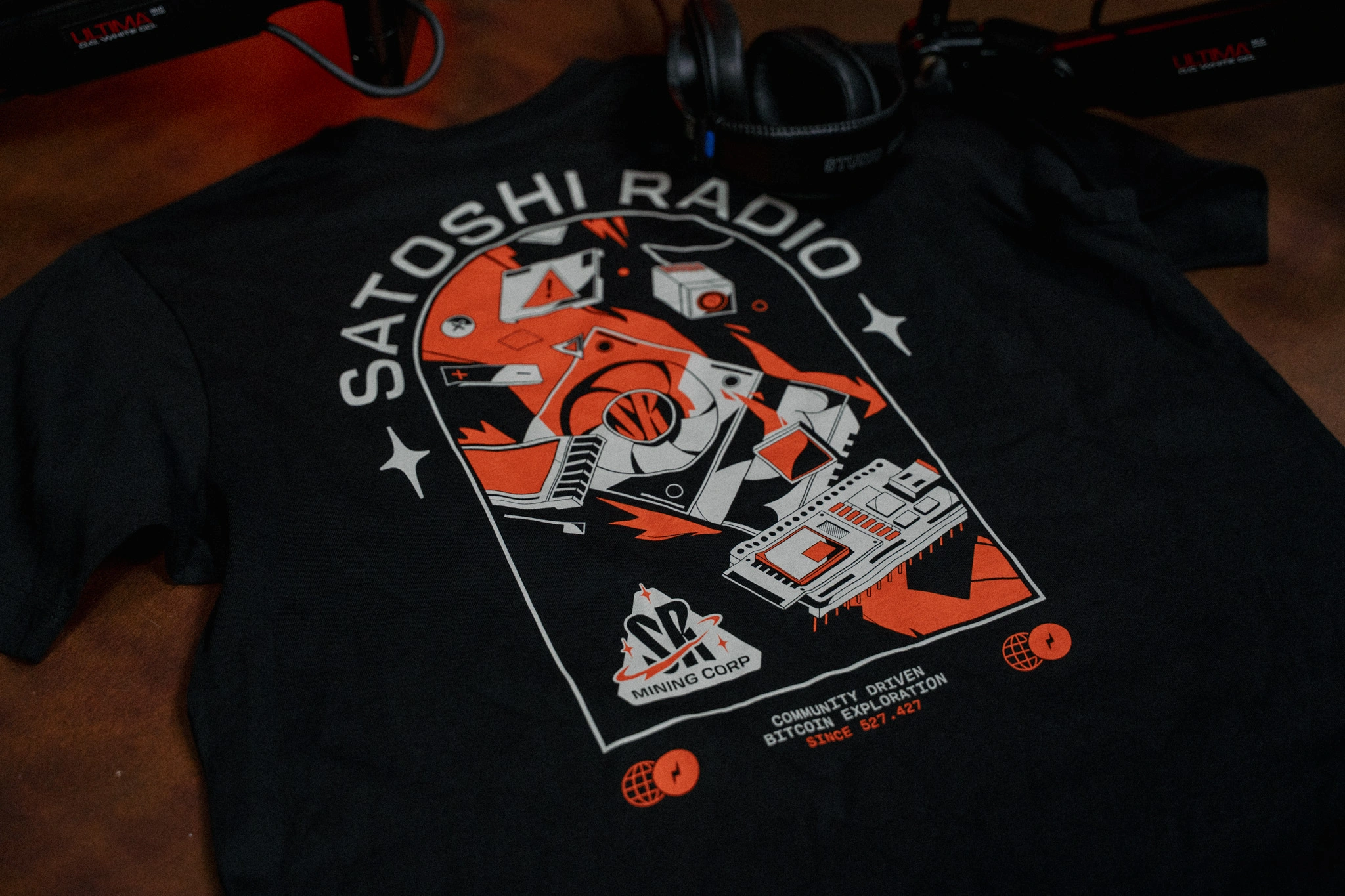 Satoshi Radio Mining Corp. T-Shirt back view displaying mining-themed graphic with Bitcoin symbols and text